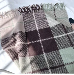 Detailed view of women thick plaid tassel cashmere-feel scarf, cozy winter neck warmer.