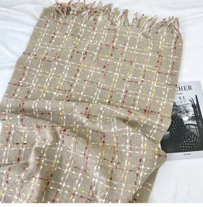 Detailed view of winter women plaid scarf, soft imitation cashmere warm shawl and neck cover.