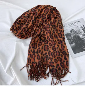 Classic leopard print cashmere-like fringe scarf detail, warm autumn and winter fashion accessory.