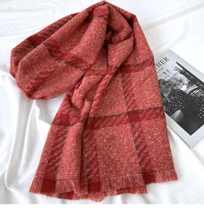 Detailed view of the red plaid winter warm tassel scarf, soft texture and cozy design.