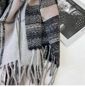 Soft imitation cashmere plaid scarf detail in grey and pink with elegant fringe trim.