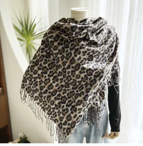 Detailed view of women classic leopard print imitation cashmere fringe shawl for autumn winter.