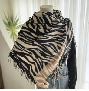 Detailed view of fashionable zebra print autumn winter cashmere feel tassel shawl scarf.