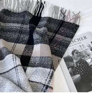 Classic plaid fringe scarf detail, soft imitation cashmere, cozy winter accessory.