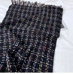 Black plaid scarf for women, winter warm fringed shawl and cozy neck wrap accessory detail.