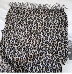 Classic leopard print scarf detail, soft imitation cashmere fringe shawl for women winter warmth.