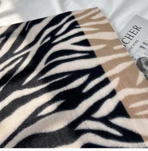 Autumn winter imitation cashmere scarf detail view, soft zebra print warm winter neck wear.