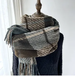 Detailed view of the thick plaid winter scarf featuring soft fringe and elegant vintage check.