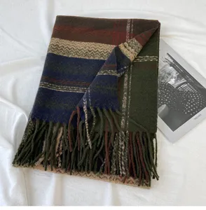 Detailed view of a cozy imitation cashmere plaid fringe scarf in retro green, blue, and brown.