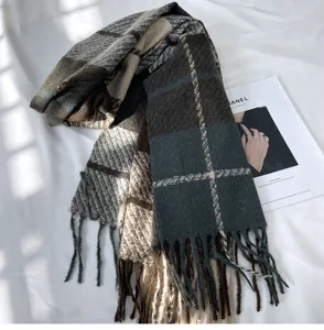 Cozy winter plaid tassel scarf in dark green and brown, soft cashmere-feel fabric detail.