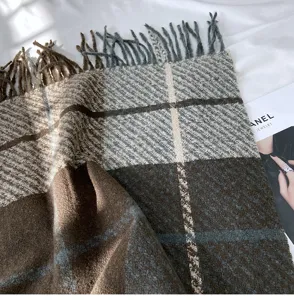 Women's thick cashmere-feel plaid fringe scarf for autumn and winter warmth and fashion.