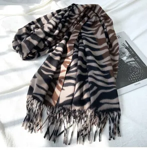 Cozy autumn winter imitation cashmere scarf featuring stylish animal print and fringe detail.