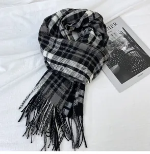 Classic black and white plaid winter scarf with cozy cashmere feel and stylish fringe ends.