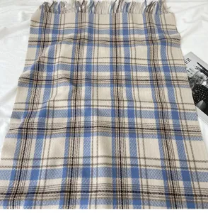Cozy blue and white plaid cashmere-feel winter scarf with elegant fringe detail.