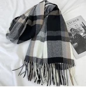 Close-up view of the classic black and white plaid imitation cashmere tassel scarf.