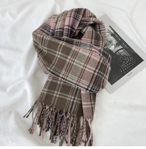 Detailed view of women's autumn winter retro plaid scarf warm tassel stylish cozy wrap.