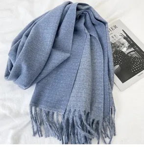 Blue cashmere feel winter scarf detail view featuring soft texture and elegant fringe hem.