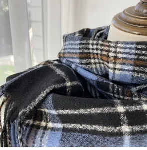 Classic blue and black plaid scarf detail, showing soft imitation cashmere texture.