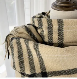 Classic plaid cashmere feel scarf detail view, soft texture and warm winter accessory.