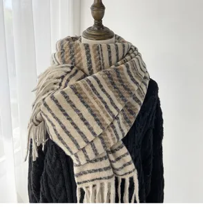 Chic brown striped tassel scarf detail, warm imitation cashmere neck warmer for cozy winter style.