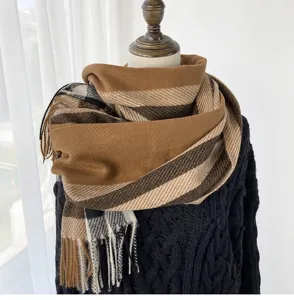 Autumn winter warm plaid tassel scarf detail view, cozy imitation cashmere fashion accessory.