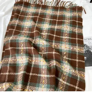 Cozy brown and green plaid cashmere-feel winter scarf with chic fringe detail for women.