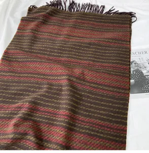 Cozy winter tassel scarf with warm brown and red striped design, stylish daily autumn neck warmer.