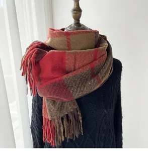 Detailed view of the thick autumn winter plaid fringe scarf, cozy design texture close up.