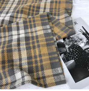 Thick plaid cashmere-feel scarf detail, cozy winter tartan shawl and warm winter neck wrap.