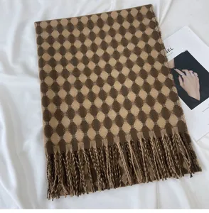 Cozy brown patterned winter scarf with soft fringe, perfect warm accessory for chilly days.