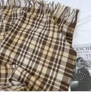 Cozy brown and beige plaid cashmere-feel winter scarf with elegant fringe trim for women.