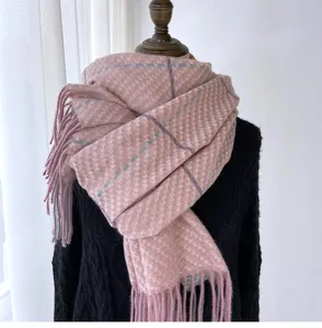 Detailed view of women's autumn winter pink plaid imitation cashmere scarf with tassels.