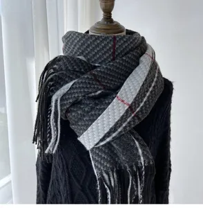Detailed view of winter thick cashmere-feel plaid scarf with black grey houndstooth pattern.