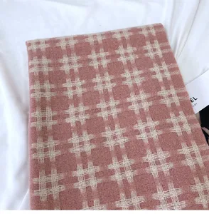 Pink grid cashmere-feel winter scarf detail view, soft cozy warm neck wrap for women.