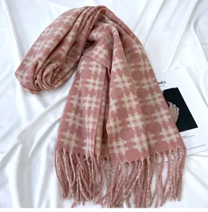 Pink grid cashmere feel scarf detail view, elegant fringe and winter warm design for women.