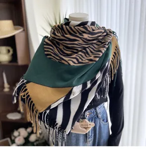 Cozy winter warm imitation cashmere scarf featuring trendy zebra print and color block fringe.
