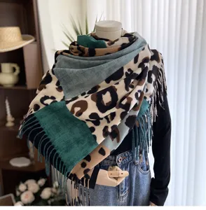 Leopard print color-block scarf detail, soft cashmere-feel fabric with chic tassels.