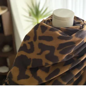 Detail view of the winter imitation cashmere scarf featuring chic leopard print and soft cozy feel.