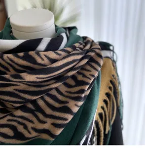 Cozy imitation cashmere scarf featuring a chic zebra pattern and stylish fringe for winter.