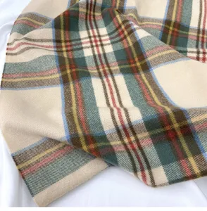 Classic plaid winter scarf in cozy imitation cashmere with elegant tartan pattern for women.