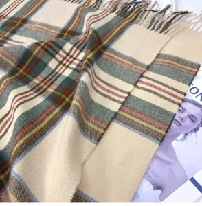 Classic plaid cashmere-feel winter scarf with elegant fringe tassels for women style.