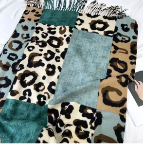 Detailed view of the color-block leopard print cashmere-feel winter warm tassel scarf.