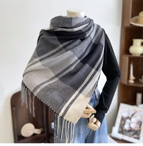 Detailed closeup view of the classic black and grey plaid cashmere-feel winter scarf.