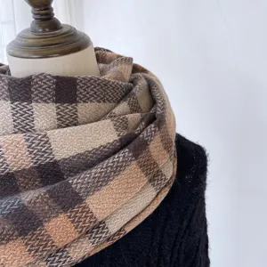 Women winter warm plaid cashmere feel scarf detail view, elegant retro brown check pattern.