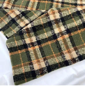 Detailed view of the winter retro green plaid scarf, soft texture, elegant design.