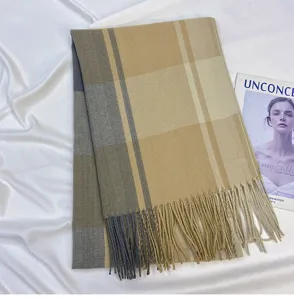 Chic women's plaid tassel imitation cashmere scarf detail, soft and warm winter fashion shawl.