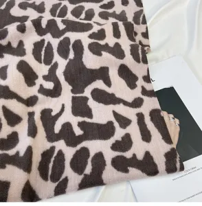 Detailed view of women winter leopard print cashmere feel scarf, stylish and warm accessory.