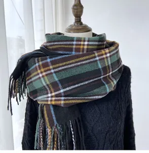 Detailed view of the retro plaid imitation cashmere scarf featuring soft texture and fine tassels.