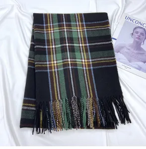 Detailed view of a classic plaid tassel scarf in green and black, perfect for autumn winter.