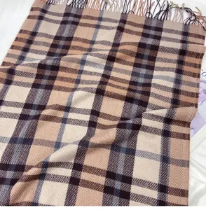 Classic plaid winter scarf with fringe detail, soft cashmere-feel fabric, cozy and warm.